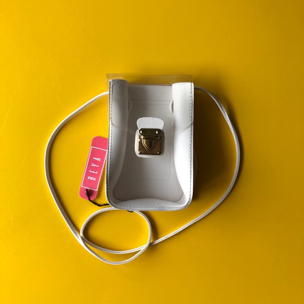 White crossbody bag, clear front.